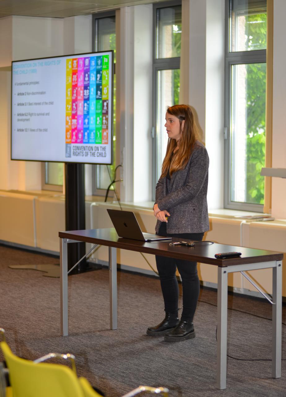 Guest speaker addressing BrusselsMUN Junior 2025 on the Convention on the Rights of the Child